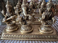 This brass Lakshmi statue from Saanskrityam Handicraft Store features the Goddess MahaLakshmi seated with four arms. She holds lotus flowers in two hands while displaying symbolic gestures with the others. Adorned with intricate jewelry and a serene expression, she embodies wealth and prosperity, making it an ideal choice for festive and auspicious gifts.