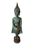 A serene Buddha statue from the Saanskrityam Handicraft Store's Buddha Dharma collection elegantly holds a bowl in its lap. Featuring intricate hair curls, elongated ears, and a flame-like ornament atop its head, this piece enhances any Buddha collection. It stands gracefully on a round, decorated base.