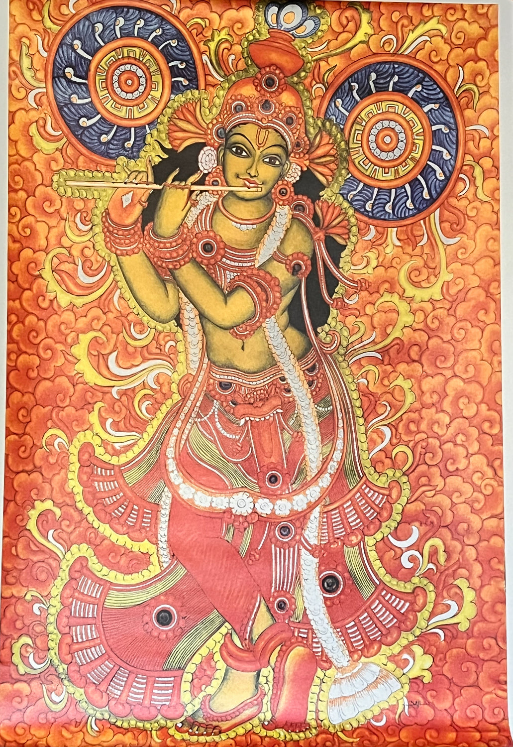 This Kerala Mural painting digital print on canvas from Saanskrityam Handicraft Store features a vivid and intricate depiction of a blue-skinned deity playing a flute, embellished with elaborate jewelry and attire. Alongside stands another figure holding a pot, while two deer at the bottom together create a tranquil Radha and Krishna scene amidst rich decorative patterns.