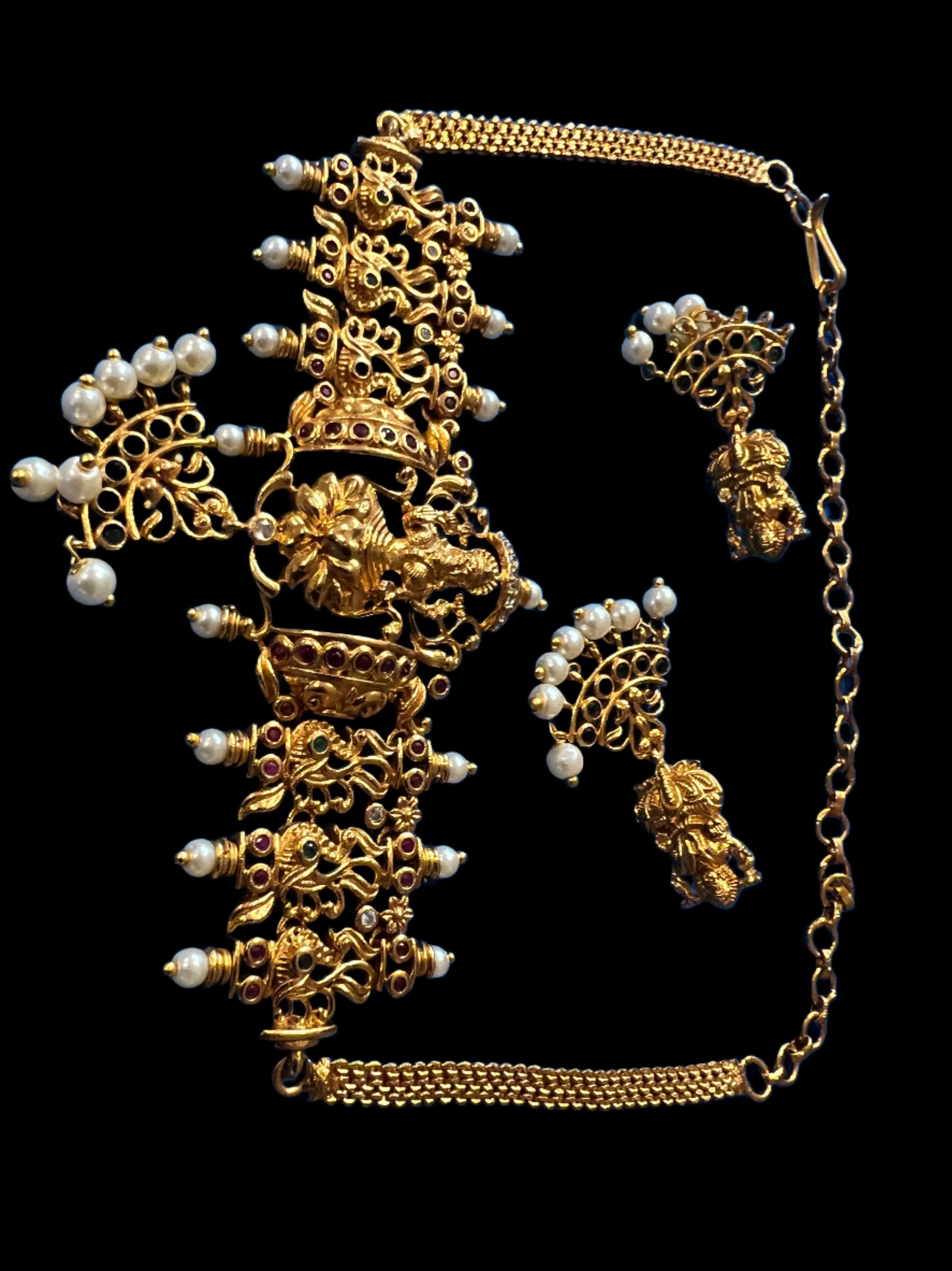 Gold Lakshmi design ,red stones,pearls,choker plus earrings ( danglings)
