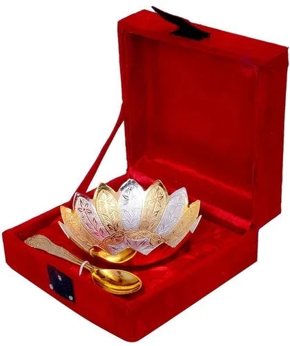 The Saanskrityam Handicraft Store presents a Gold Plated Leaf Boxed Gift set, featuring an intricate decorative bowl and two ornate spoons, elegantly displayed inside an open red velvet box.